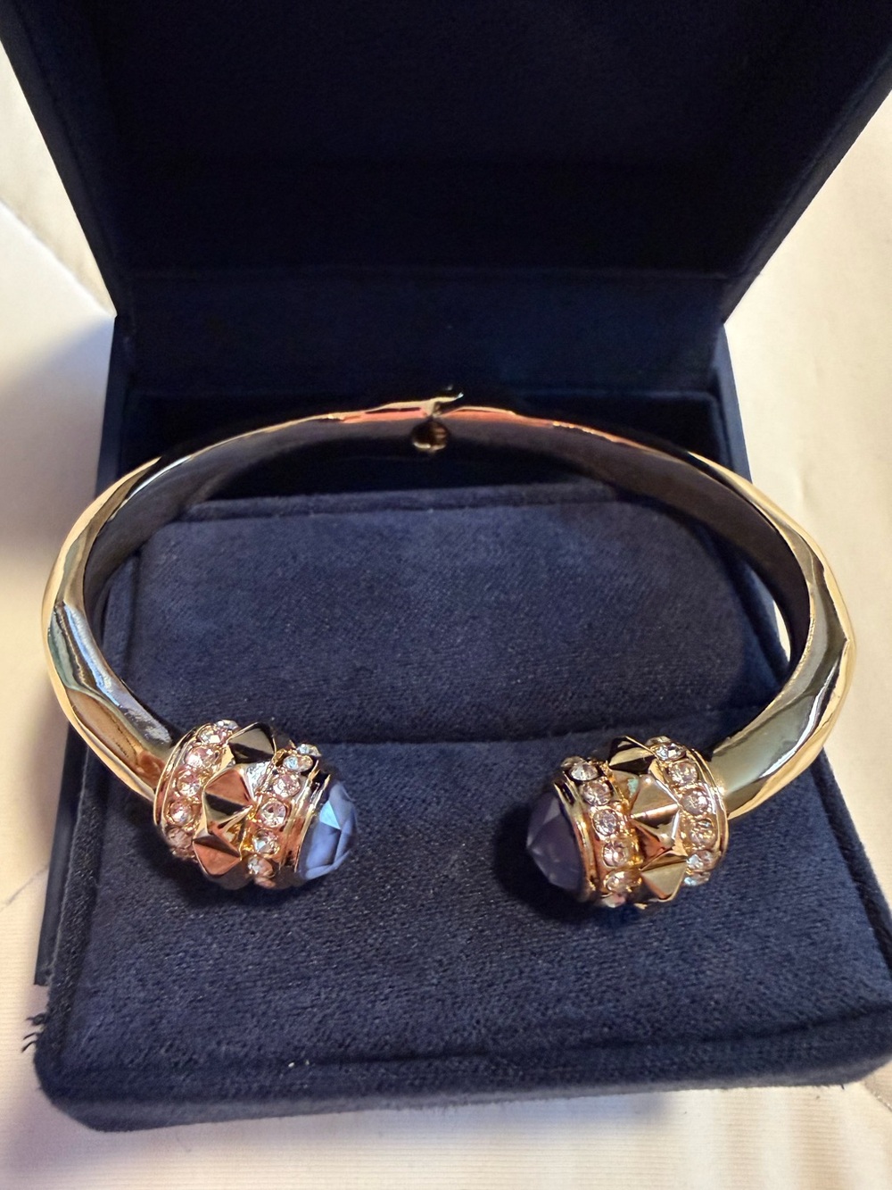 Gold Plated Open Cuff Hinge Bracelet with Blue Crystal Accents